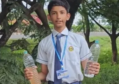 Student holding water bottles